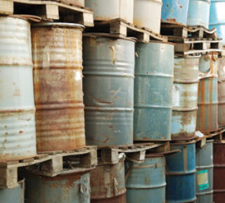 rusty 44 gallon drums on pallets